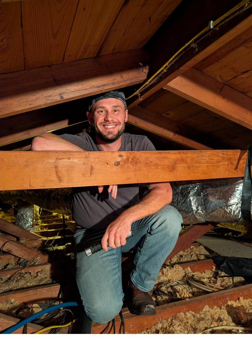 Aaron Klein inspecting a home attic